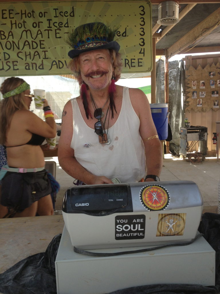 one of the many volunteers who sell coffee at Center Camp. He promoted being an individual while taking my order