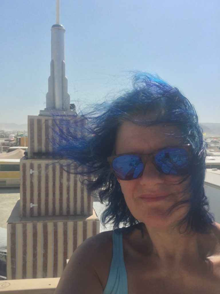 blue hair blowing in the wind at Burning Man