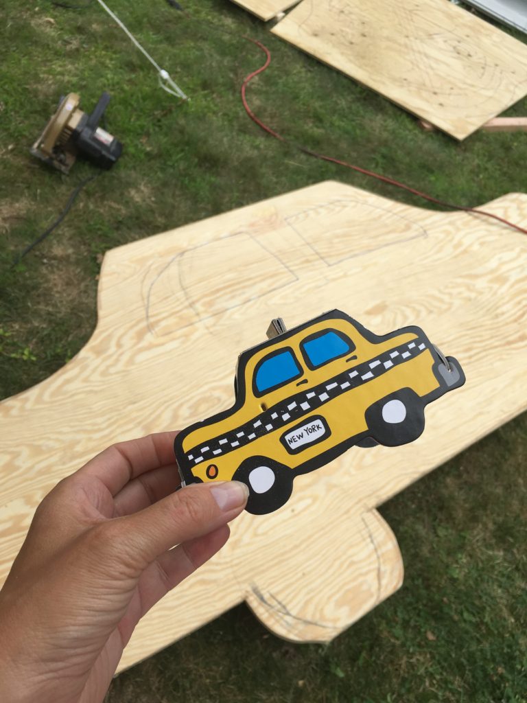 cutting the taxi cab from wood