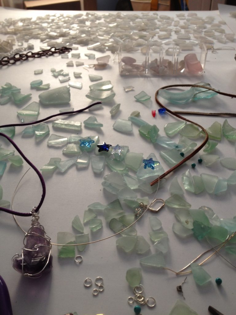 Play with Spring cleaning by turning a table full of sea glass into jewelry