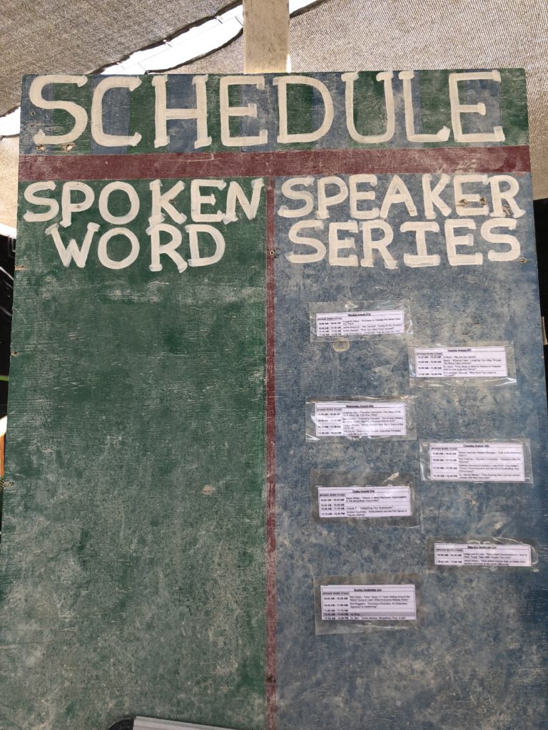 chalkboard showing schedule at Burning Man