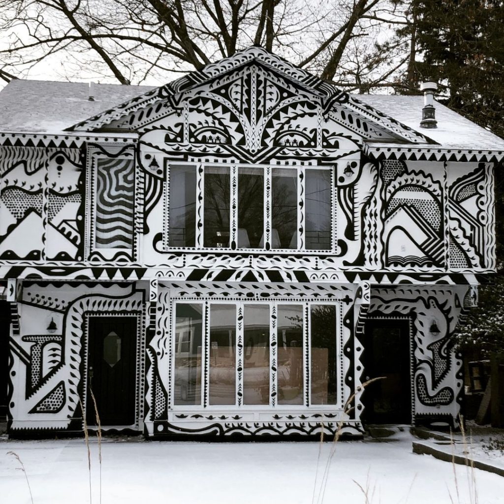 black and white pattern painted on outside of house in Northport, MI
