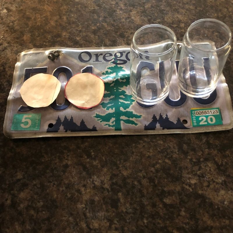 beer tasting glasses on an Oregon license plate