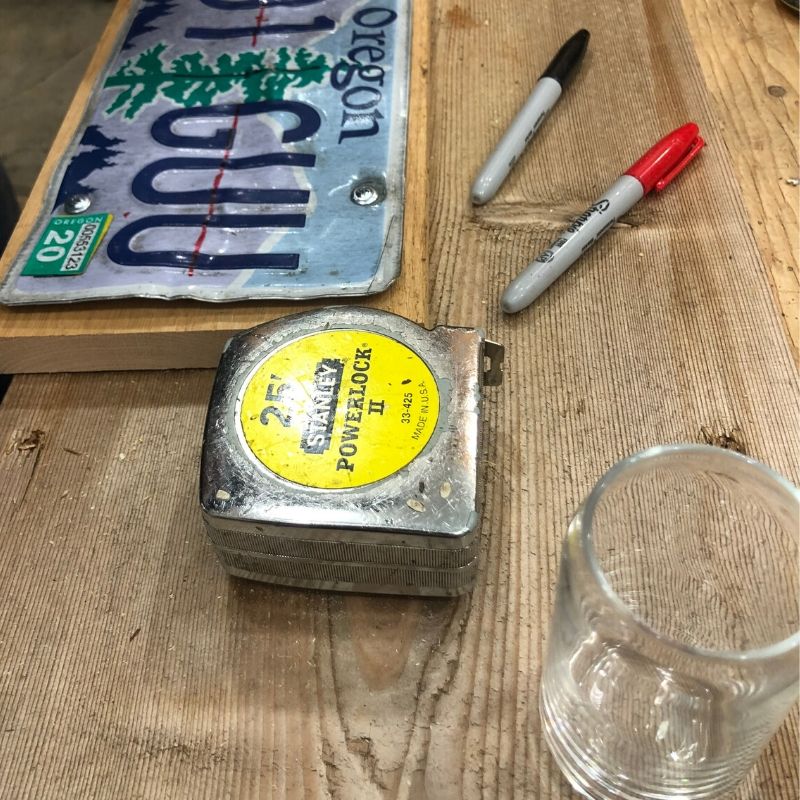 measuring tape, beer tasting glass and an old Oregon license plate