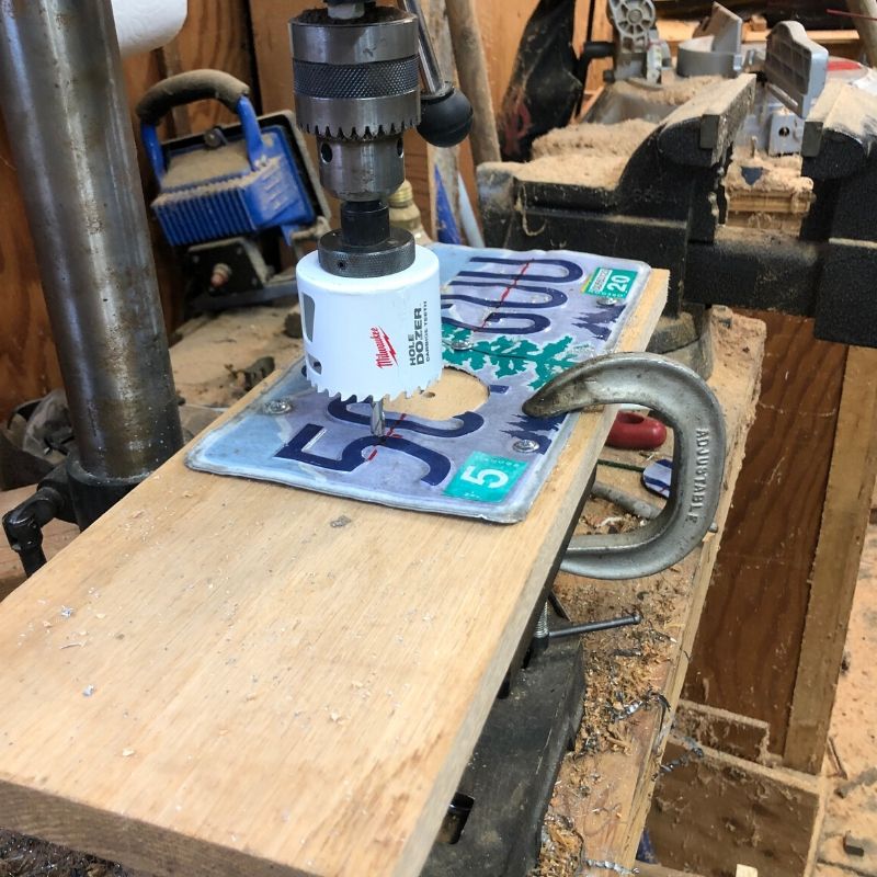 drill press to saw the hole in a license plate