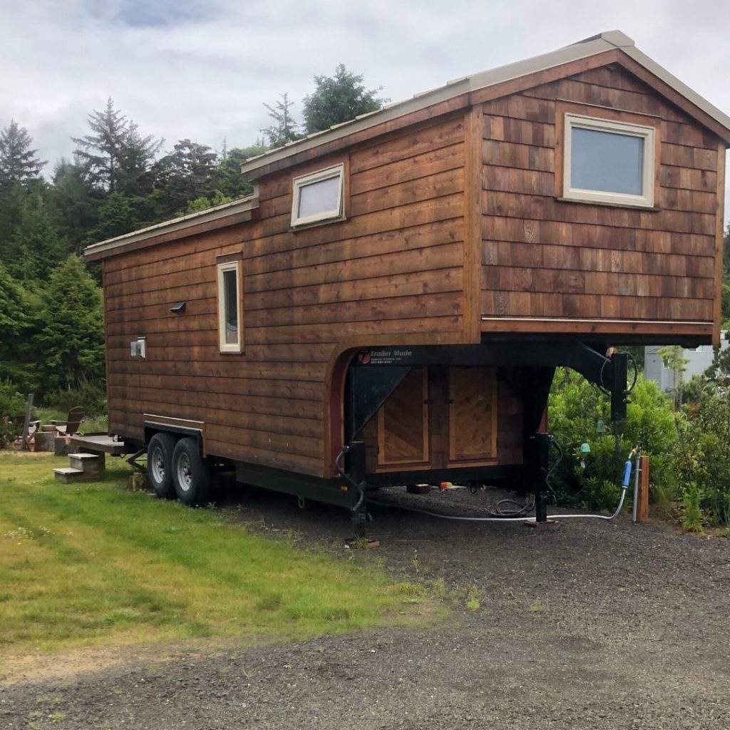 brown wood goose neck tiny house