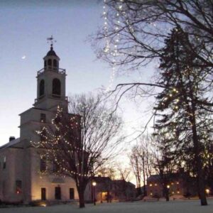 Bedford, Massachusetts Unitarian Universalist Church lit up with holiday lights