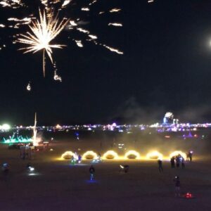 Burning Man at night featuring Adventuremobiles art