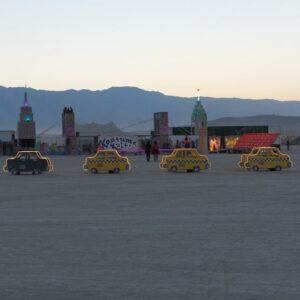 taxi art installation at Burning Man at sunset. Photo by David Katz