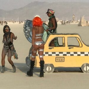 3 young women playing on Adventure Mobile Taxi at Burning Man