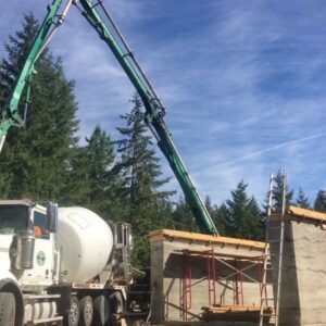 pouring the cement that lays between the earth and roof