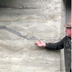 Dave showing the Mary's Peak design in his rammed earth home
