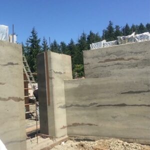 wall construction at the build stage of the rammed earth home
